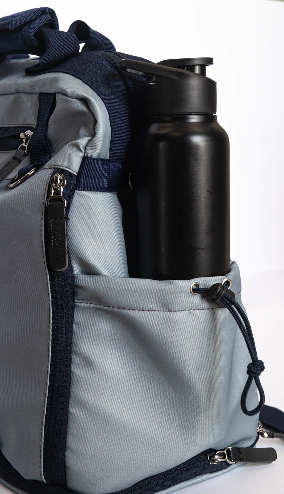 The side pocket holding an insulated flask