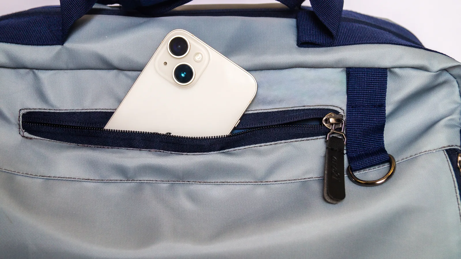 The external quick-access pocket, sized for a phone
