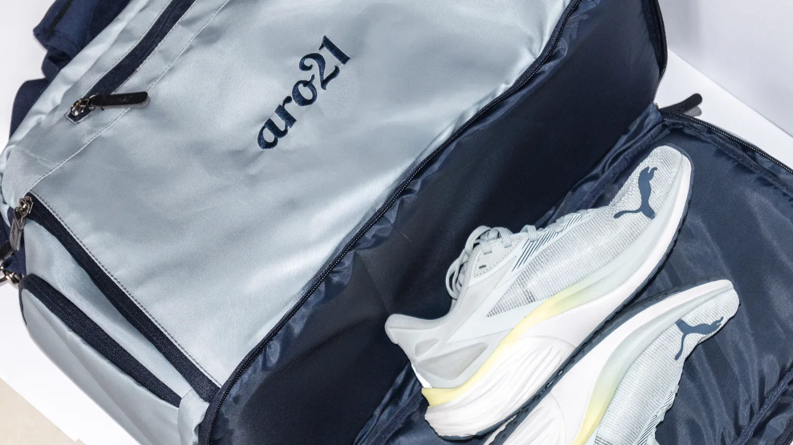 The sealed shoe compartment, holding a pair of trainers