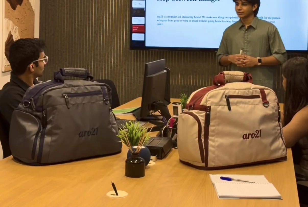 The Slate and Dawn Duffels on a boardroom table during an aro21 presentation